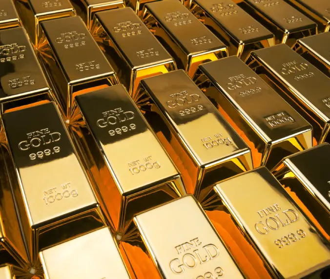 A close up of many gold bars on top of each other